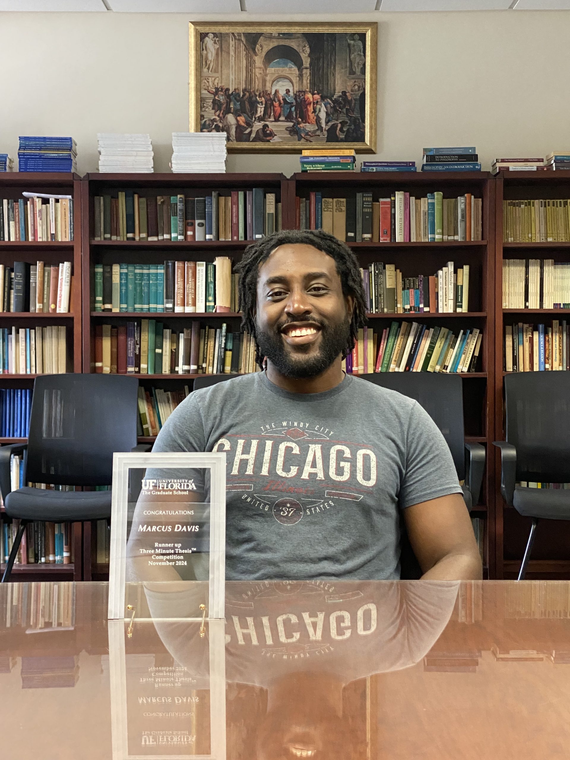 Marcus Davis Earns Dissertation Fellowships, Runner-Up in 3MT Competition, and Teaching Award
